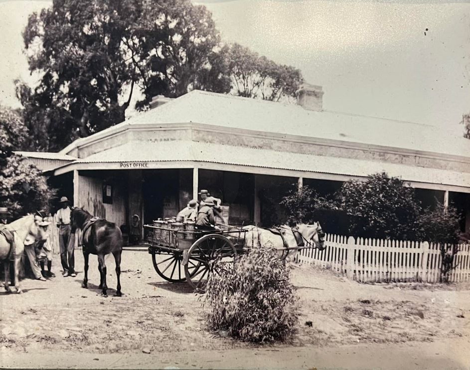 Historic photograph of old Ashbourne with a horse and cart outside the post office